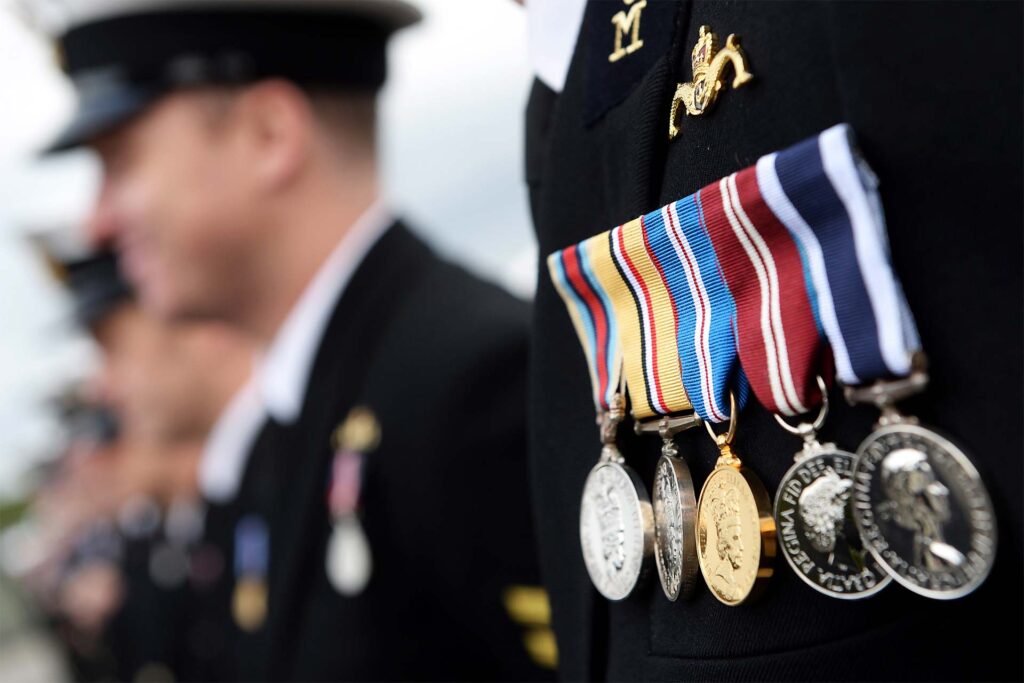 A closeup of medals on someones lapel
